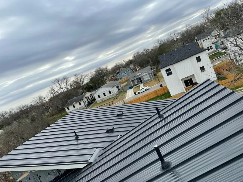 Standing seam metal roof panels with vents for Skylight Repair in Wells Branch